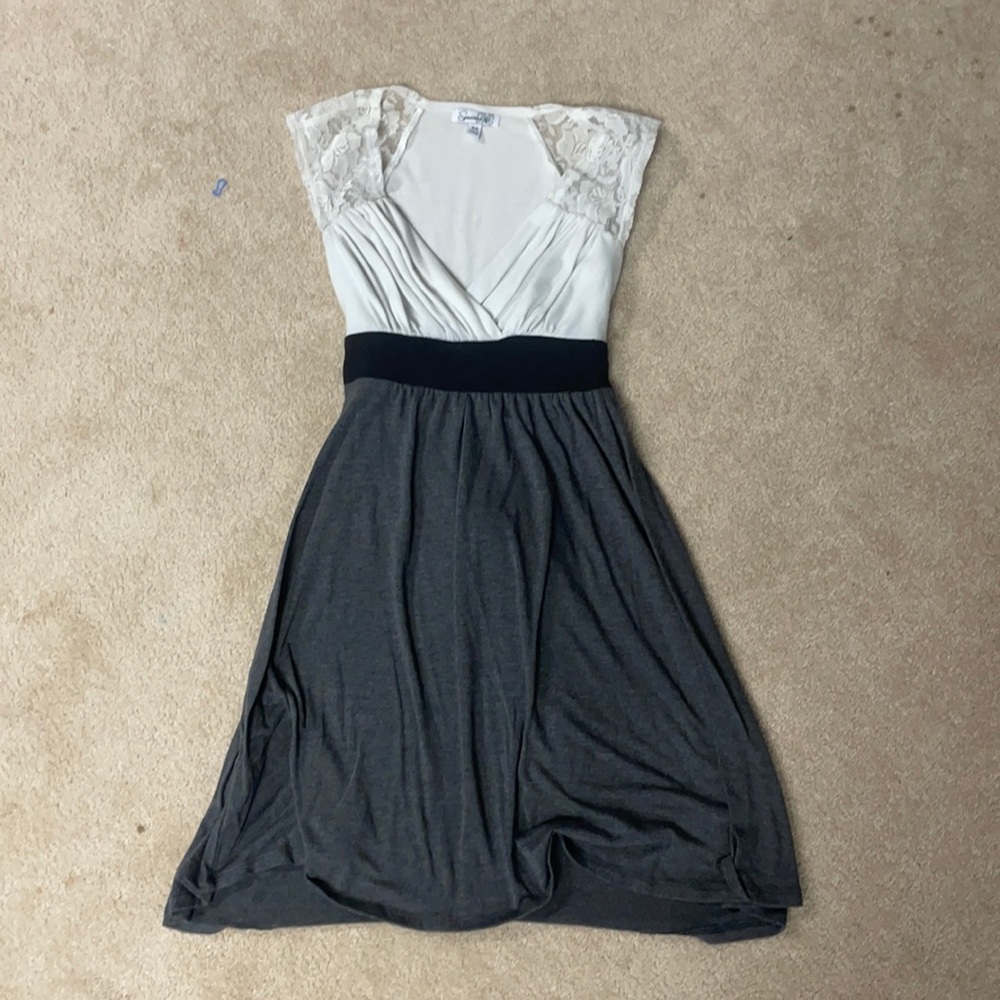 Black, grey, white dress with lace sleeves and tie back. Size XS.